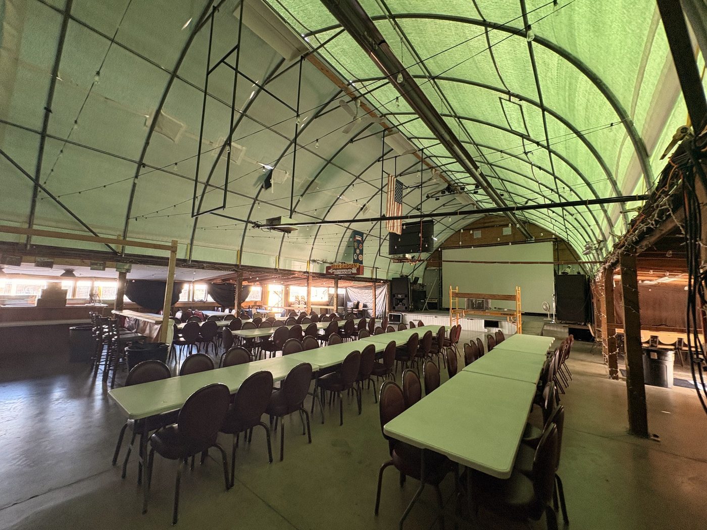 The event hall set with long tables at Last Chance Bar & Grill